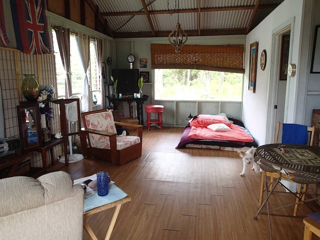 interior space featuring vaulted ceiling with beams and wood-type flooring