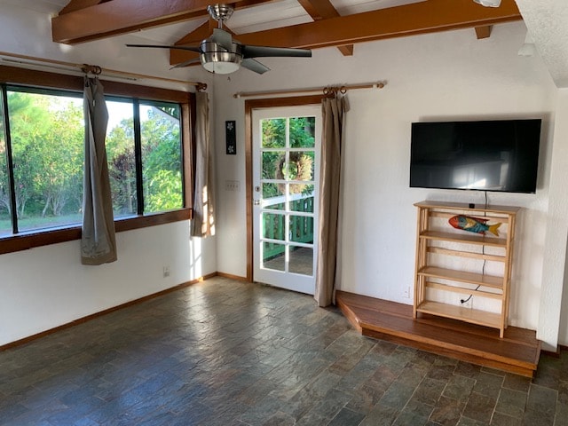 spare room with dark hardwood / wood-style flooring, ceiling fan, and beamed ceiling