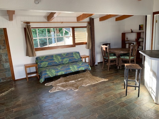 living room with beamed ceiling