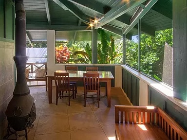 sunroom featuring lofted ceiling with beams