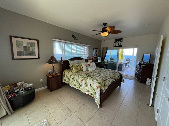 tiled bedroom with ceiling fan and access to outside