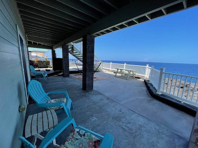 view of patio featuring a water view