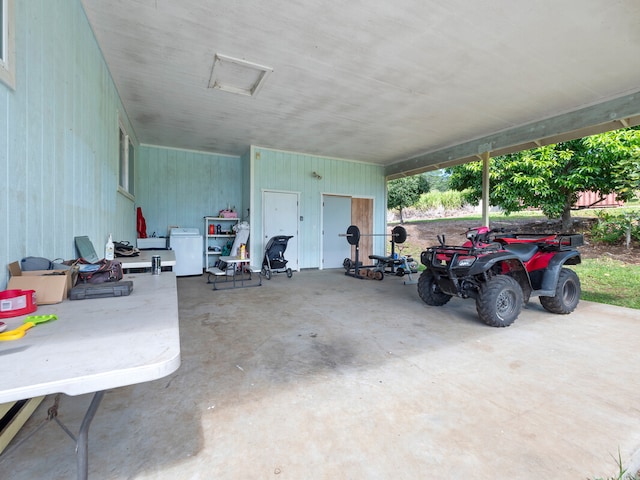 garage featuring white fridge