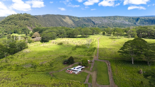 drone / aerial view with a mountain view and a rural view