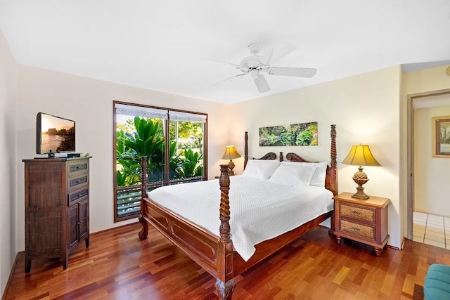 bedroom with ceiling fan, hardwood / wood-style floors, and access to exterior