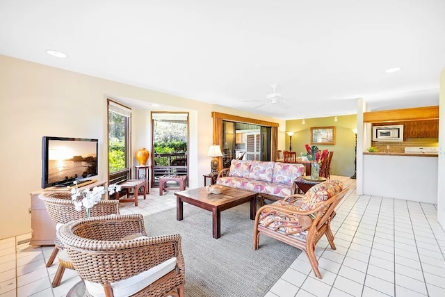 living room with light tile patterned floors, ceiling fan, and recessed lighting