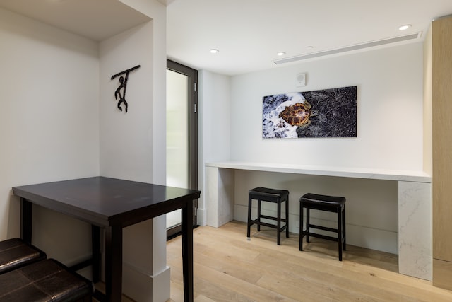 dining area with light hardwood / wood-style floors