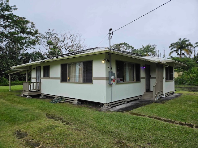 view of property exterior featuring a yard