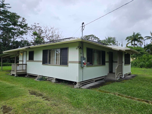 view of home's exterior featuring a lawn