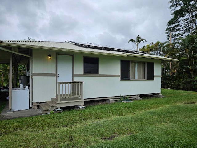 back of house with a yard