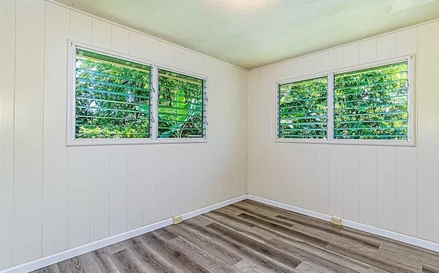 unfurnished room featuring hardwood / wood-style floors