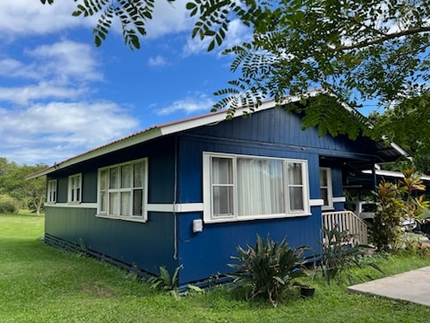 view of side of home featuring a yard