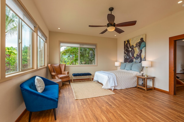 bedroom featuring ceiling fan and hardwood / wood-style floors