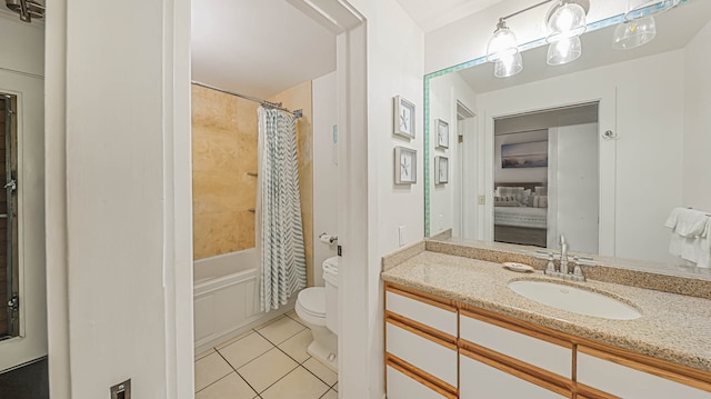 full bathroom with vanity with extensive cabinet space, toilet, tile floors, and shower / tub combo with curtain