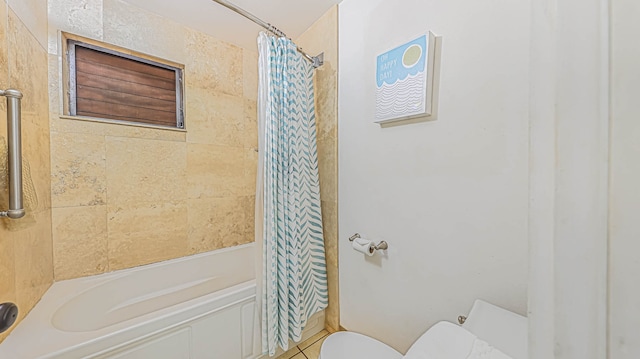 bathroom featuring tile floors, toilet, and shower / bath combo with shower curtain