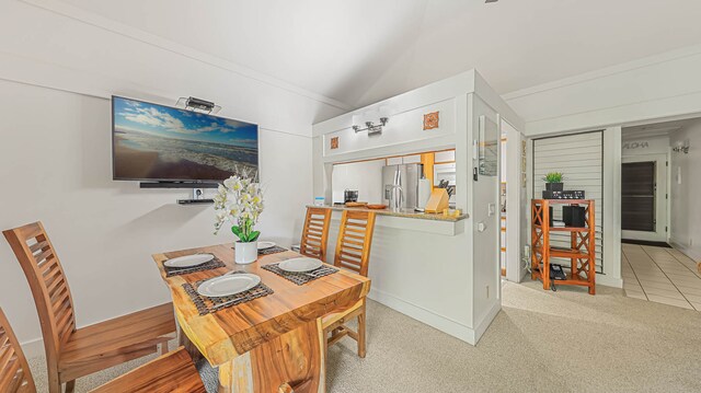 dining room featuring light carpet