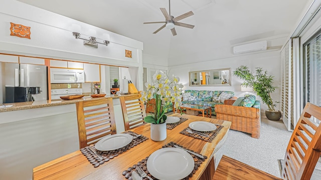 carpeted dining area with a wall unit AC, ceiling fan, and a high ceiling