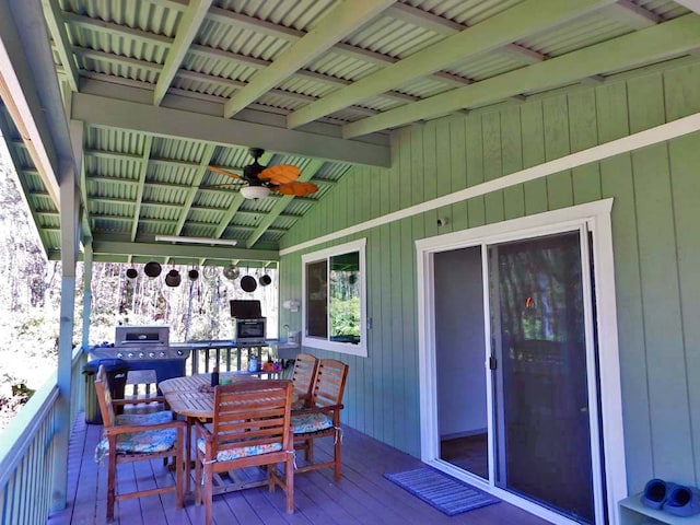 wooden terrace featuring ceiling fan