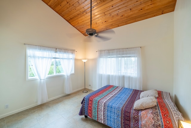 bedroom with tile floors, wood ceiling, ceiling fan, and vaulted ceiling