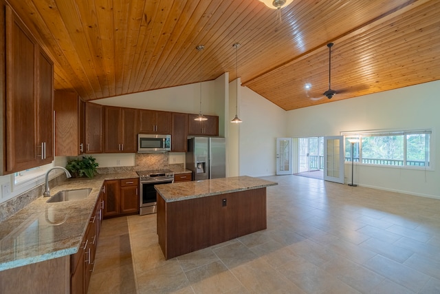 kitchen featuring appliances with stainless steel finishes, decorative light fixtures, a kitchen island, sink, and wooden ceiling