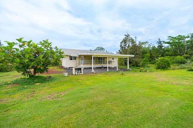 back of house featuring a yard