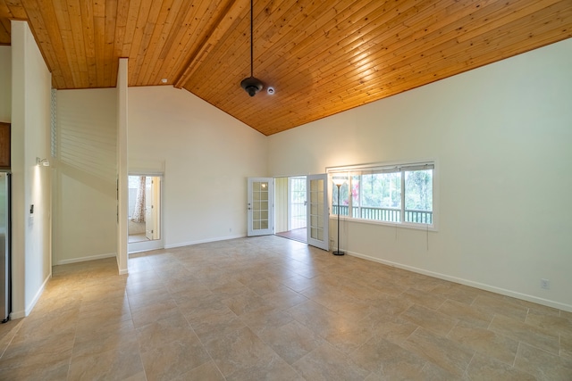 empty room featuring high vaulted ceiling, light tile floors, and wood ceiling