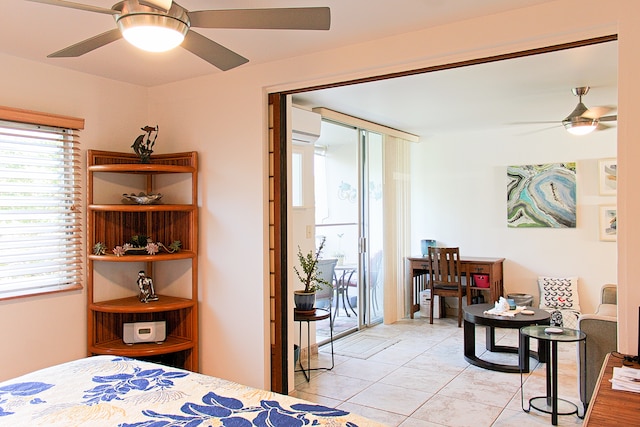 tiled bedroom featuring ceiling fan, access to outside, and an AC wall unit