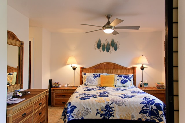 bedroom with ceiling fan and light tile patterned floors