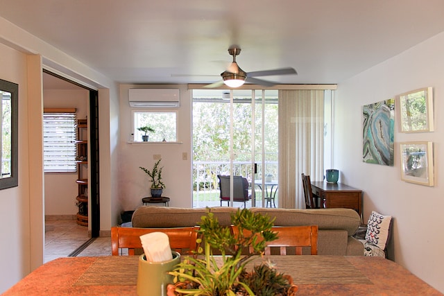 tiled dining space featuring ceiling fan and a wall mounted AC