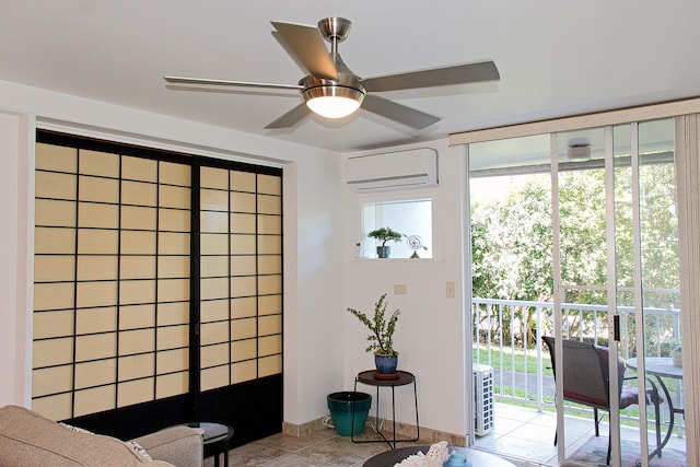 interior space with ceiling fan, light tile patterned floors, and a wall mounted AC