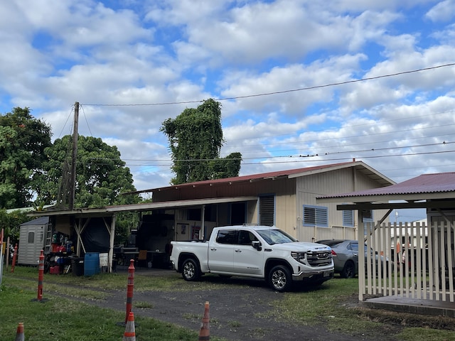 view of front of home with a carport