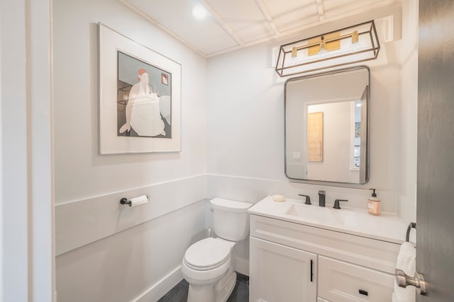 bathroom featuring oversized vanity and toilet