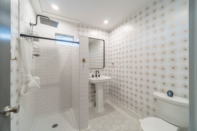 bathroom featuring a shower with curtain, tile flooring, sink, and toilet