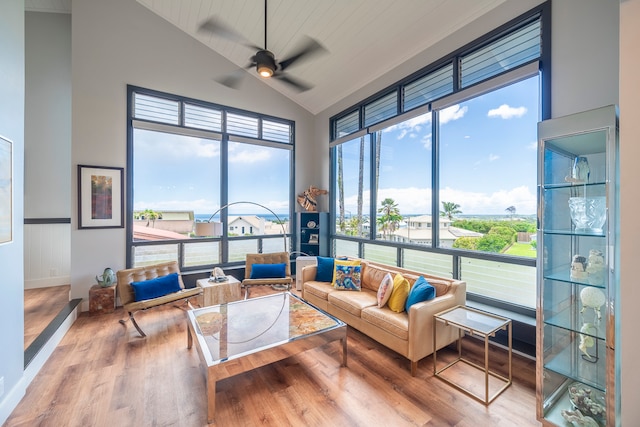 sunroom featuring ceiling fan and vaulted ceiling