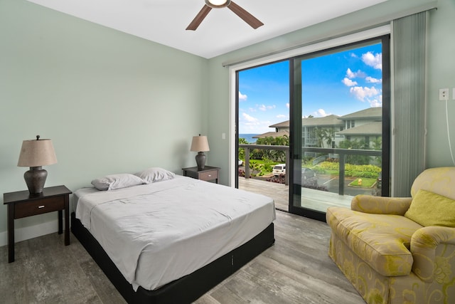 bedroom featuring access to exterior, light wood-type flooring, and ceiling fan