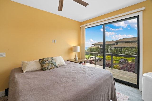 bedroom with multiple windows and ceiling fan