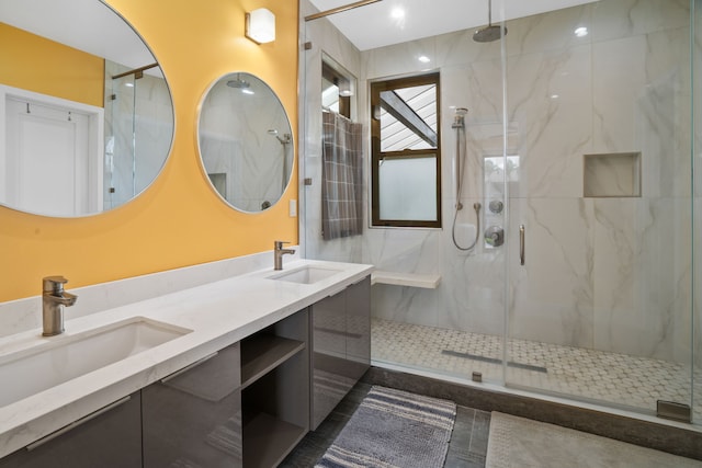 bathroom with vanity and a shower with shower door