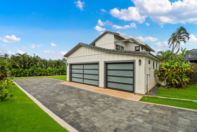 garage with a lawn