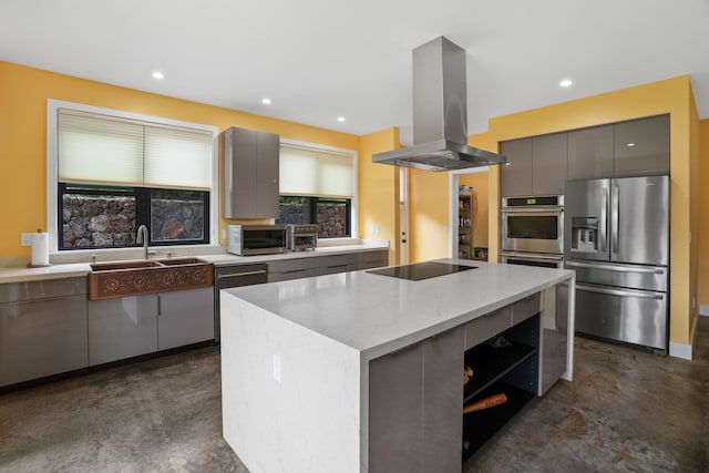 kitchen with gray cabinetry, a center island, light stone counters, island exhaust hood, and stainless steel appliances