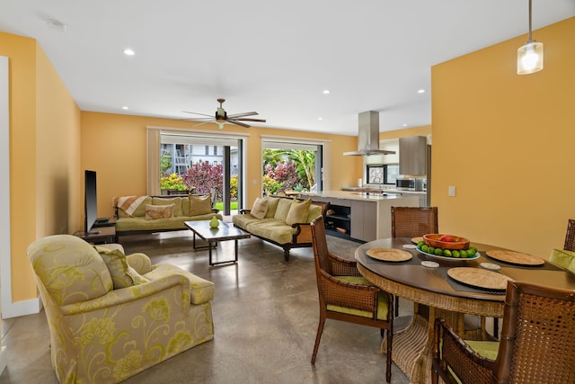 living room with concrete flooring and ceiling fan