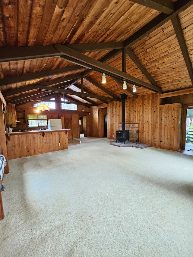 stairway featuring a wealth of natural light, high vaulted ceiling, and wood ceiling