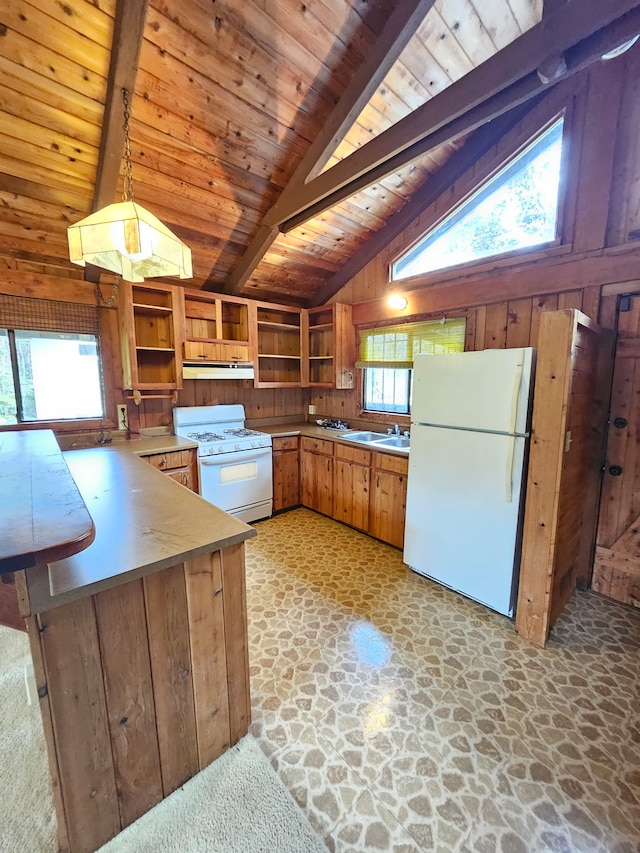 kitchen featuring vaulted ceiling with beams, a wealth of natural light, and wooden ceiling