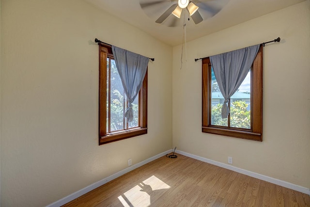 unfurnished room with ceiling fan and light hardwood / wood-style flooring