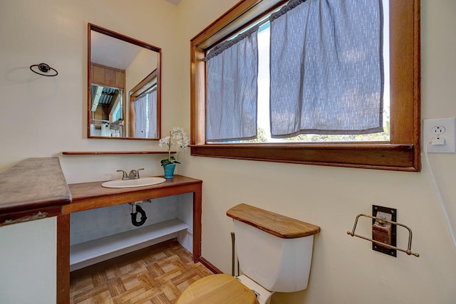 bathroom featuring sink and parquet floors