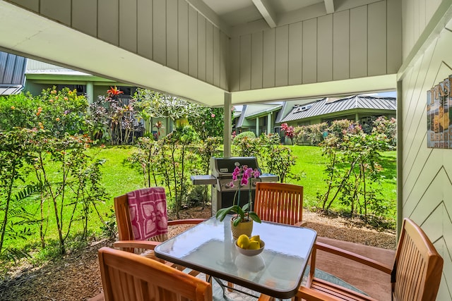 sunroom with beamed ceiling