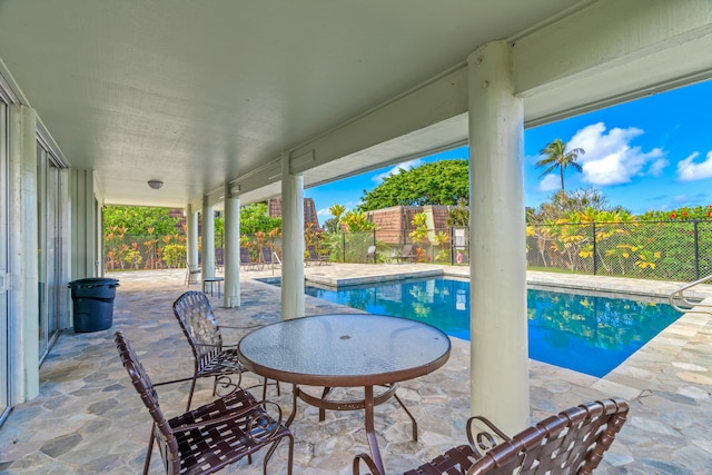 view of swimming pool with a patio area