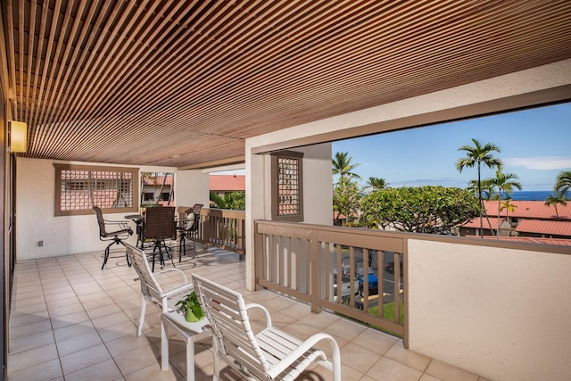 view of patio featuring a balcony