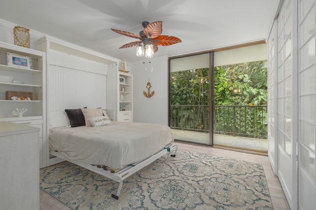 bedroom with access to exterior, floor to ceiling windows, ceiling fan, and crown molding