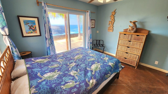 bedroom with a water view, access to exterior, and baseboards