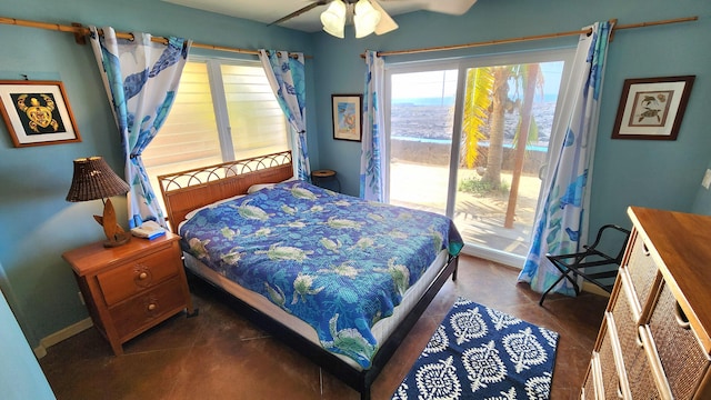 bedroom featuring access to outside and a ceiling fan